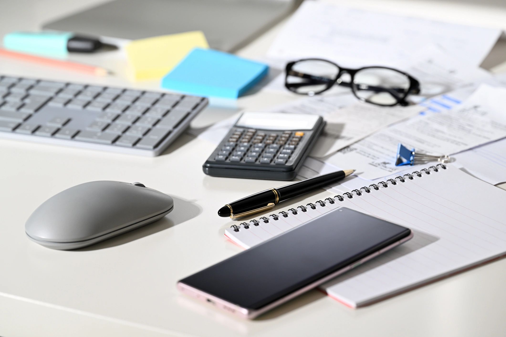 Payroll and accounting paperwork on a desk