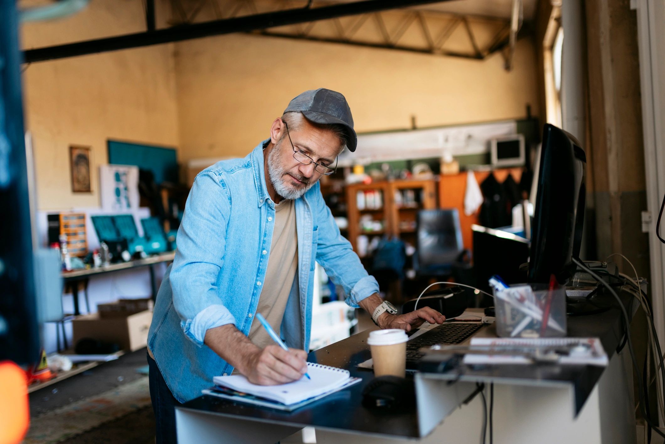 Small business owner reviewing paperwork and notes